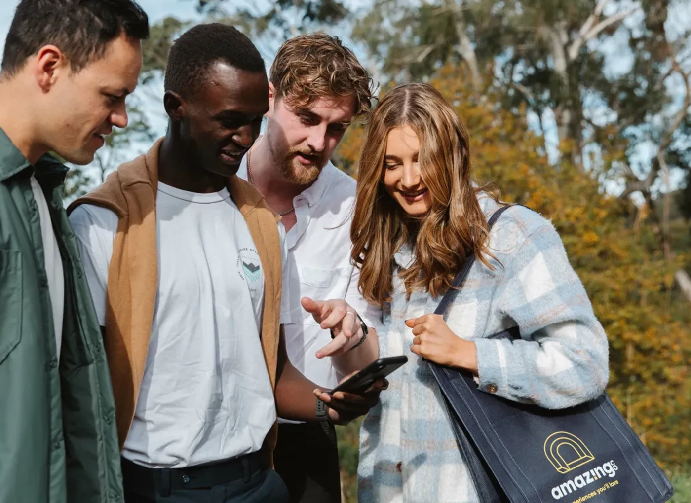 Friends solving a clue together during a Marylebone Mystery Picnic